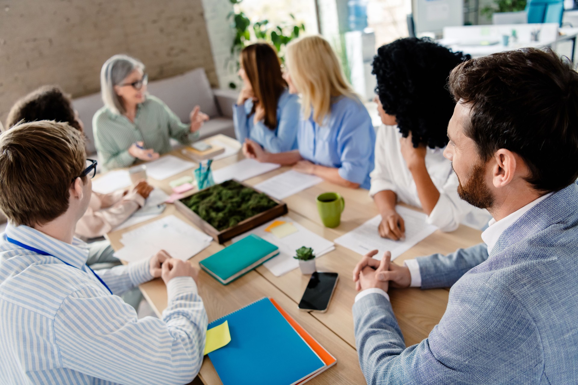 Diverse group of professionals collaborating in a bright modern office space